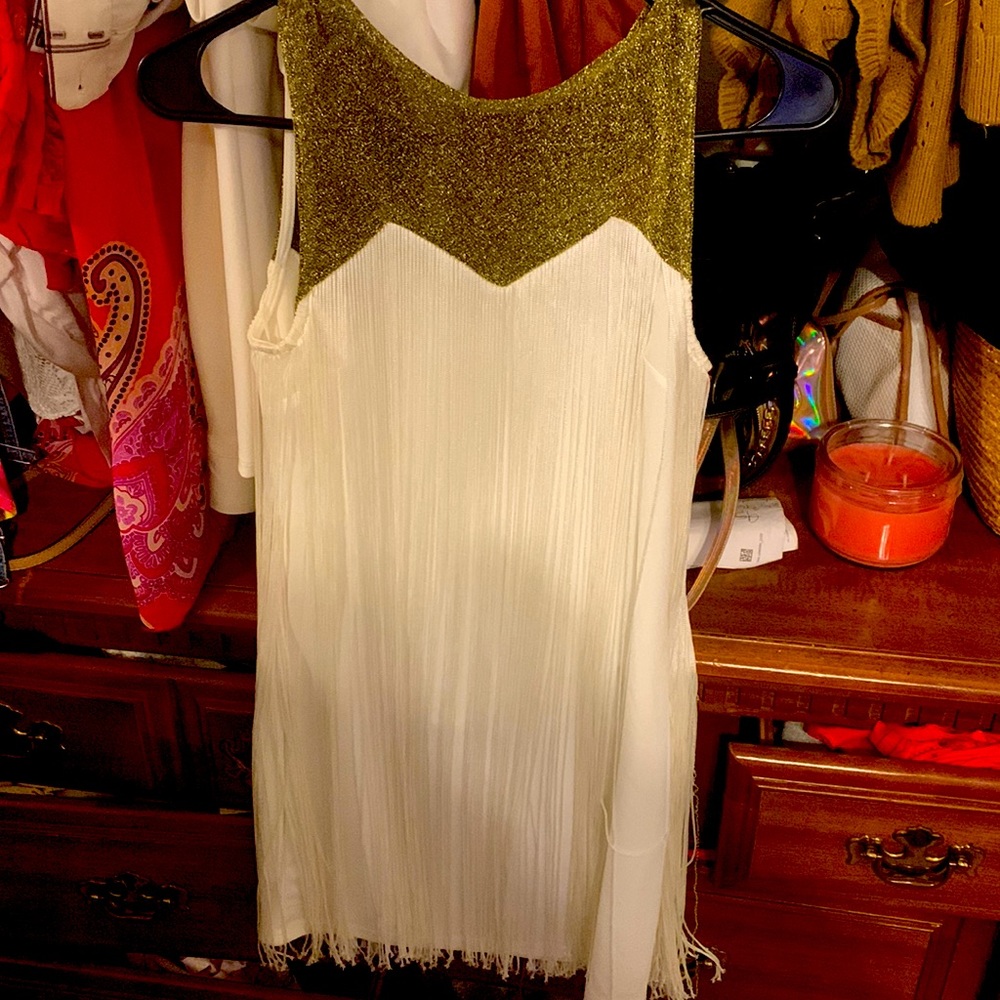 Sleeveless gold tassel blouse. Great New Year’s Eve!great effortless look